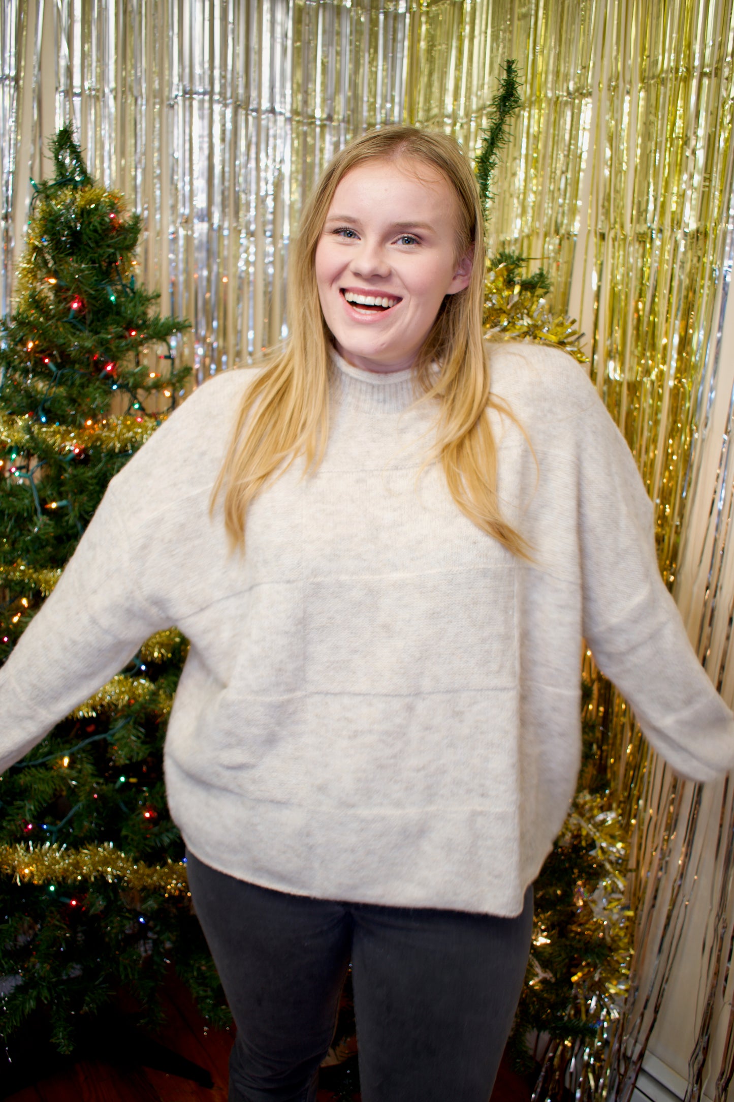 Model wearing a cream-colored sweater