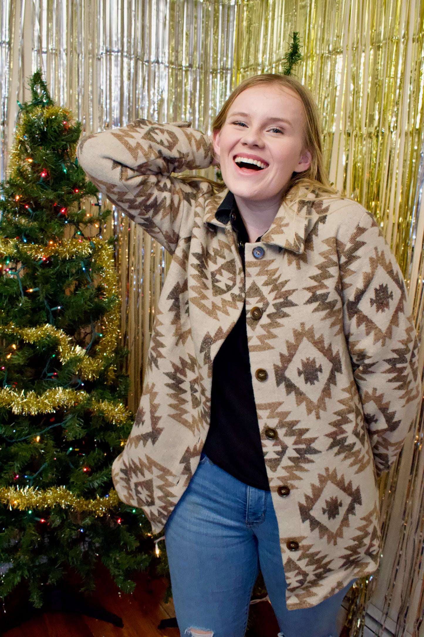 Model wearing a shacket with a vintage aztec print