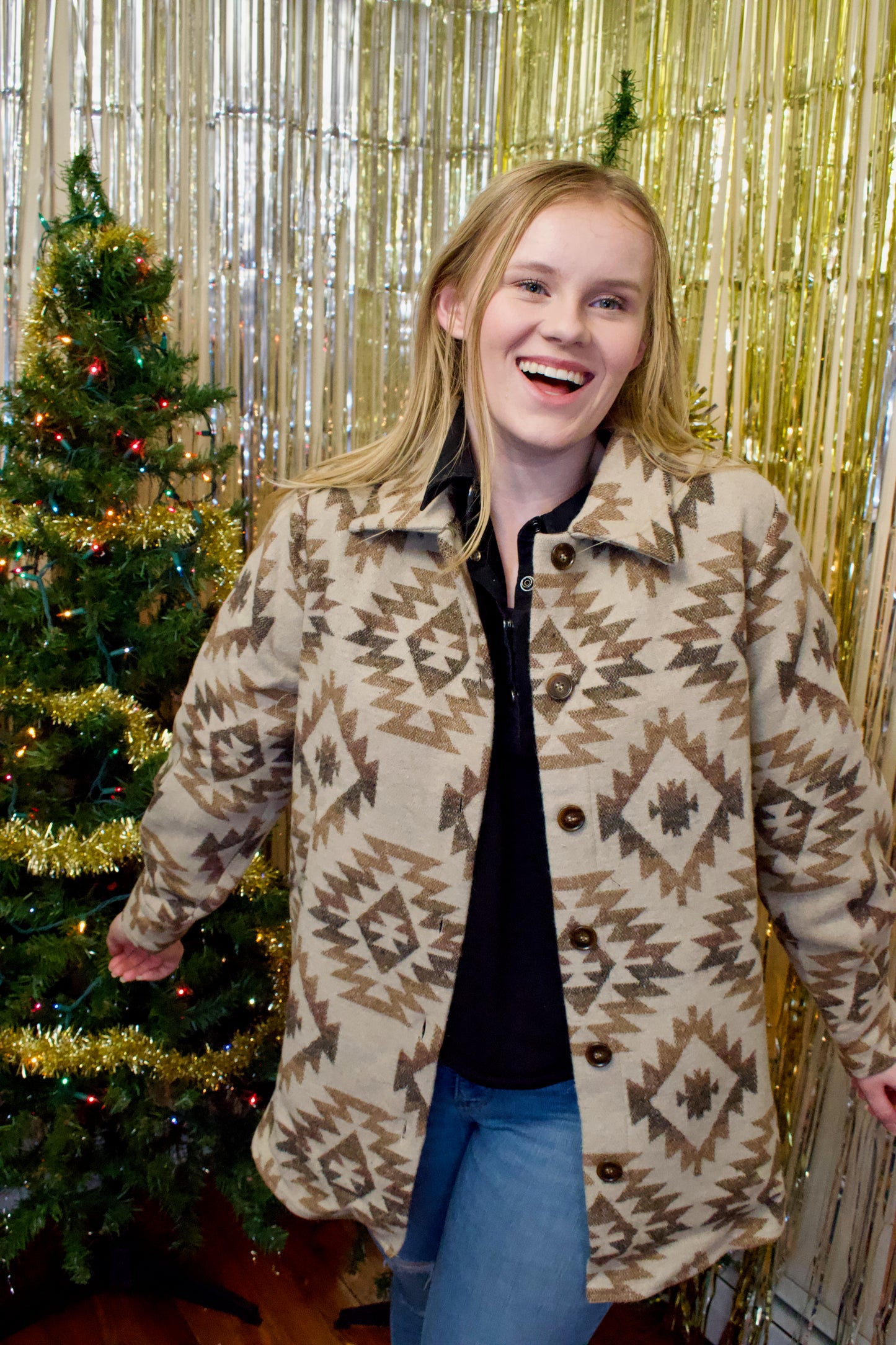 Model wearing a shacket with a vintage aztec print