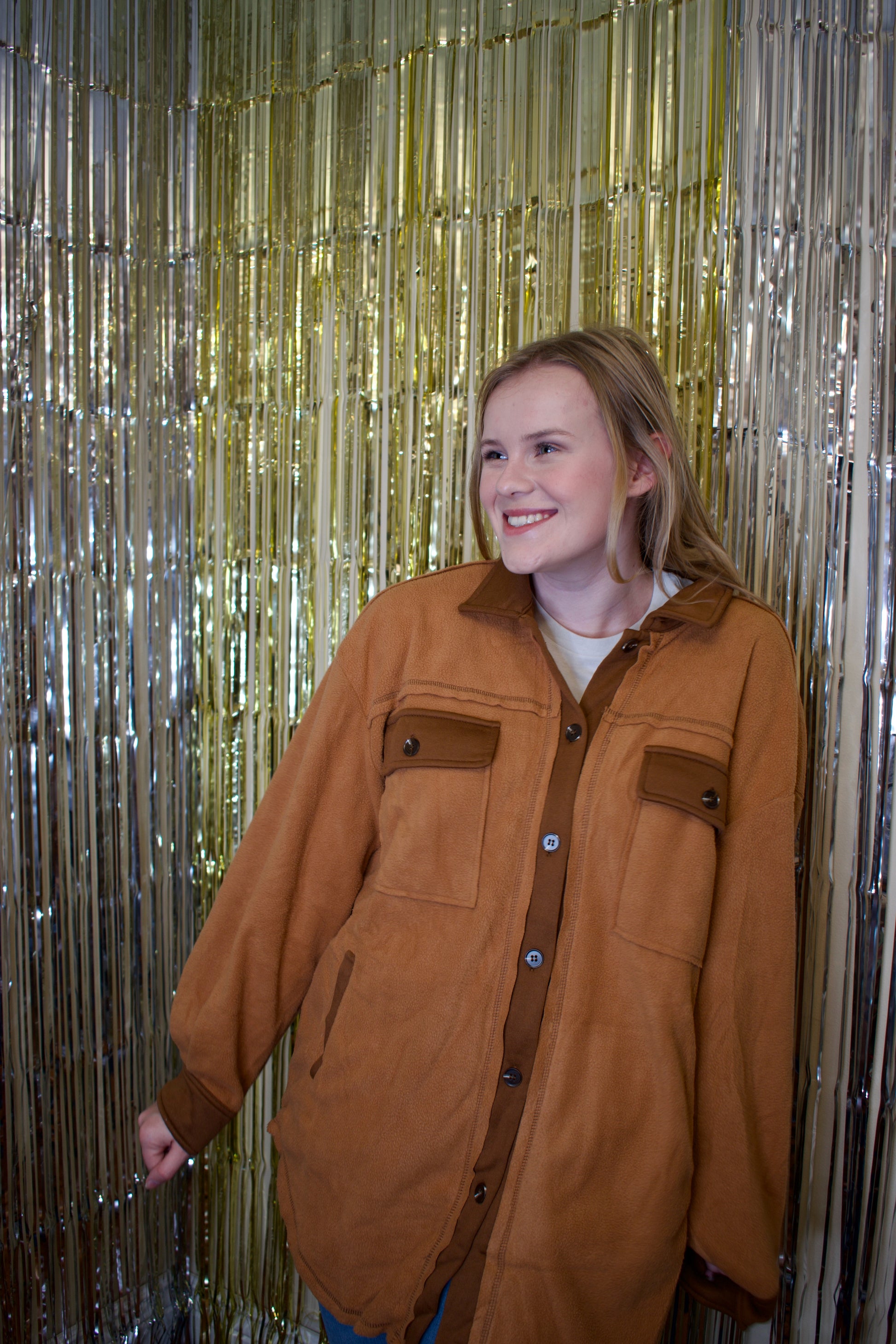 Model wearing a camel-colored, soft-textured shacket