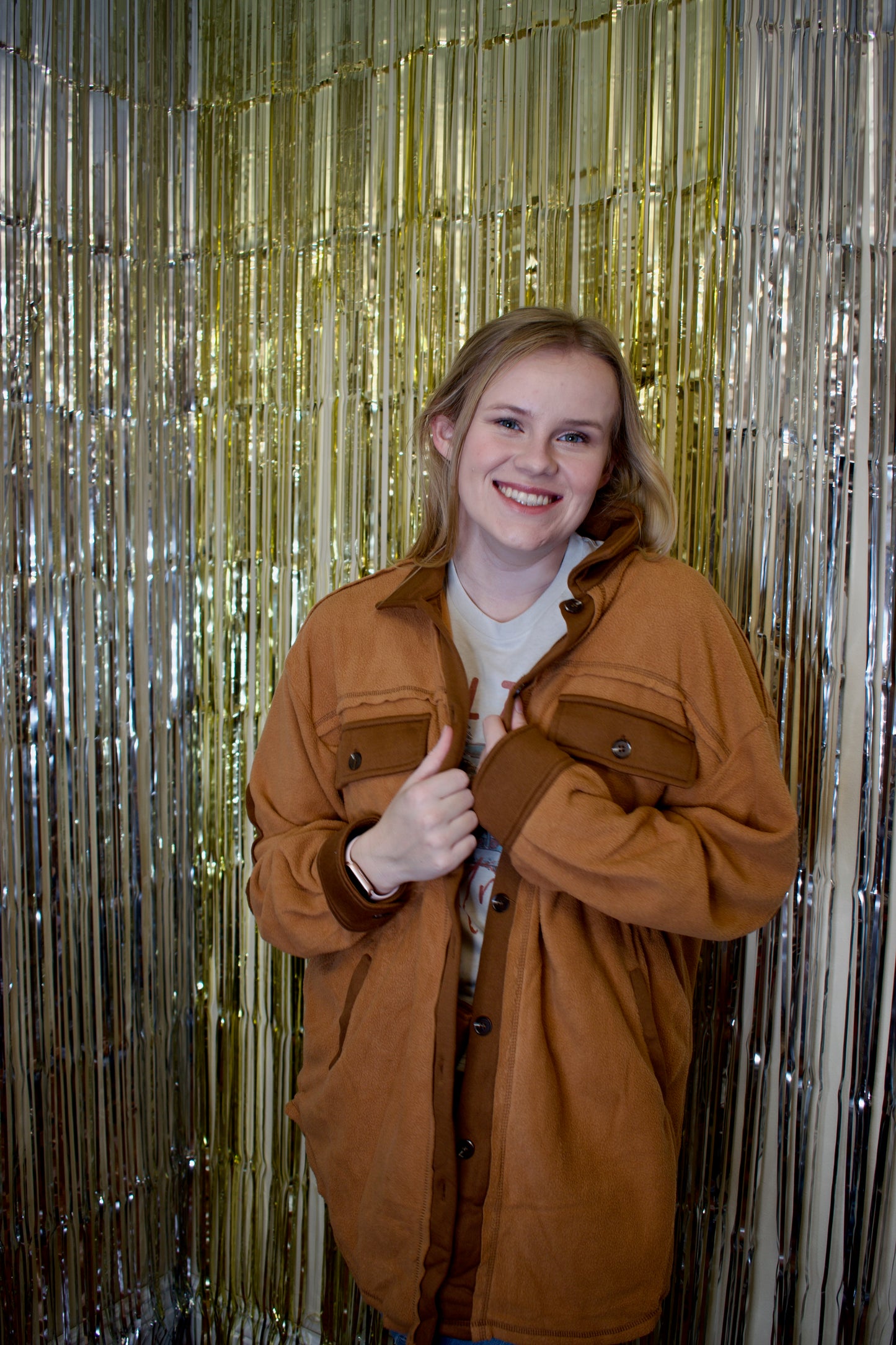 Model wearing a camel-colored, soft-textured shacket